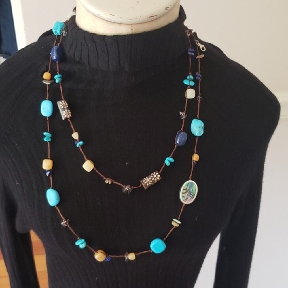 Very long Turquoise stone/bead necklace. Colors are Blue, Brown, Cream.